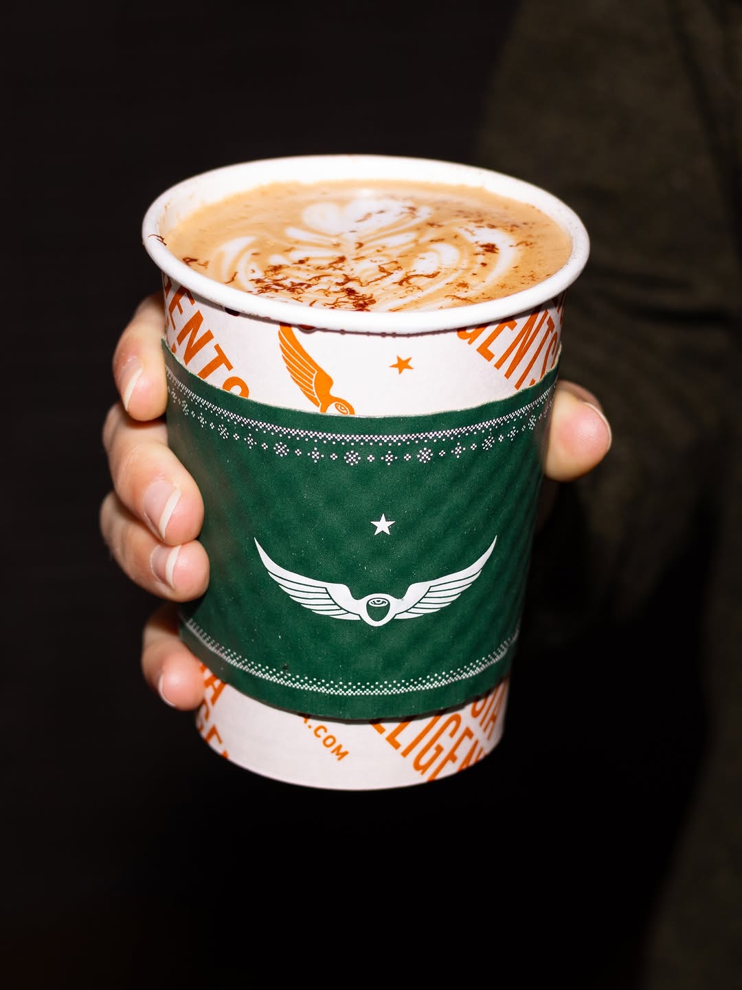 Java Jacket branded sleeve in use at @intelligentsiacoffee.